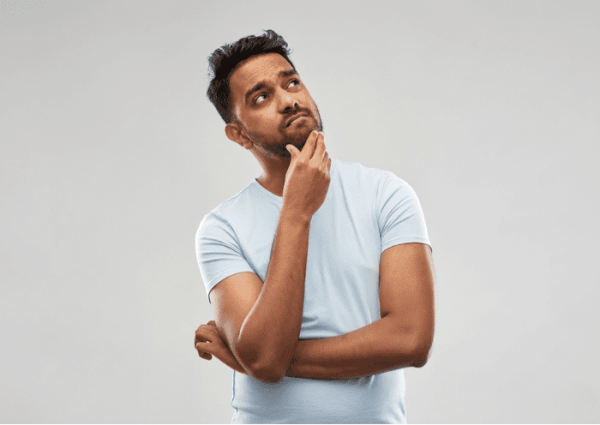 Man thinking about gold loan questions